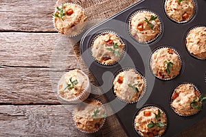 Muffins with ham and cheese in baking dish. Horizontal top view
