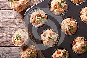 Muffins with ham and cheese close up in baking dish. horizontal