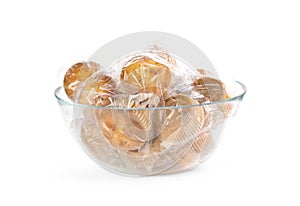 Muffins in plastic packaging. Closeup. On a white background