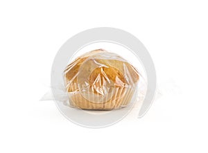 Muffins in plastic packaging. Closeup. On a white background