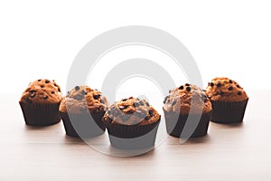 Muffins with a white background on a wooden table
