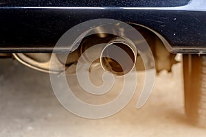 Muffler and tailpipe on a car, the section of the exhaust system photo