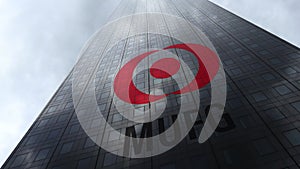 MUFG logo on a skyscraper facade reflecting clouds. Editorial 3D rendering
