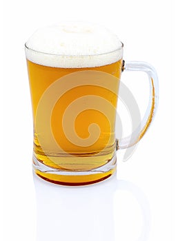 Mug of beer with foam on white background with shadow reflection. Half a liter of beer in glass on white backdrop.