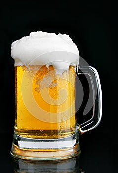 Mug of beer with froth photo