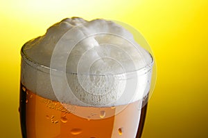 Mug of beer with froth close-up