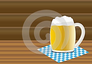Mug of beer on a wooden table.