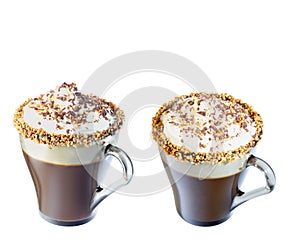 Mug of cappuccino with whipped cream. A mug of chocolate and roasted nuts. Isolate on a white background.