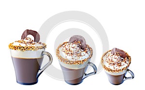 Mug of cappuccino with whipped cream. A mug of chocolate and roasted nuts. Isolate on a white background. The photo.
