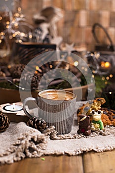 Mug of cocoa with chocolate chip cookies on a wooden table. Christmas drink and biscuit, festive decoration with