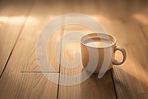 Mug of coffee on the floor background