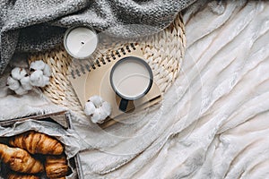 Mug with coffee and home decor on tray