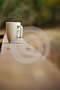 Mug of coffee on a ledge or wall