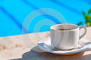 Mug with coffee on a table in a cafe