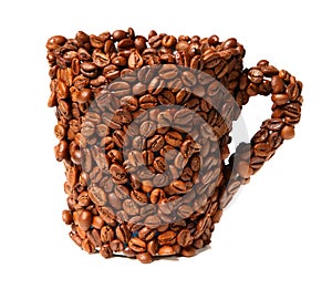 Mug covered with coffee beans isolated on white