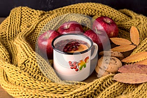 Mug or Cup of Hot Berry Lemon Tea With Yellow Warm Knitted Scarf Autumn Maple Leaves Wooden Background Autumn Cold Season Red Appl