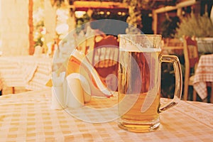 Mug of draft beer on restaurant table