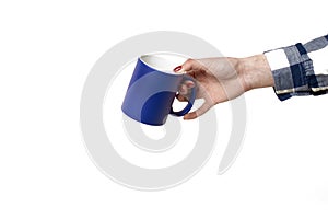 Mug for drawing an image on it in a female hand on a white background