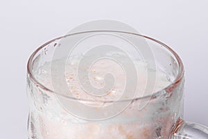 Mug of fresh light beer with foam isolated on a white background