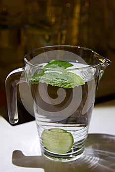 A mug of fresh water with lemon