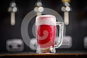 mug full of chopp, with chopp pilsen on a rustic table.