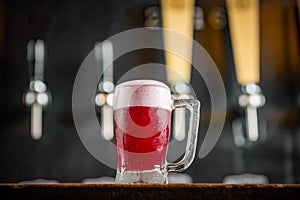 Mug full of chopp, with chopp pilsen on a rustic table