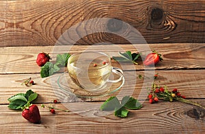 Mug with herbal tea of strawberries and strawberry