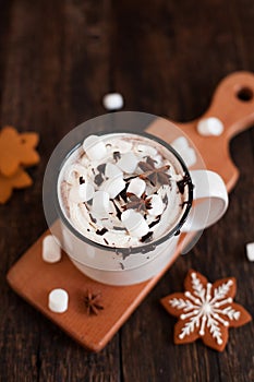 Mug of hot chocolate or cocoa with Christmas cookies and marsmallow