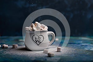 Mug with hot chocolate cocoa drink and marshmallow