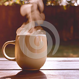 Mug of hot drink steams in sunlight on wooden table during Fall season. AI Image