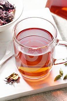 Mug of hot hibiscus tea on table