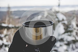 A mug of hot tea, mountain view