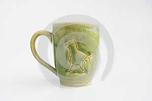 Mug with the image of the Cat. Author`s ceramics. Color Celadon egyptian symbolism.