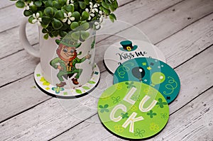 a mug with the image of a leprechaun and a quatrefoil, a horseshoe for happiness and good luck. St.Patrick \'s Day.