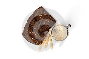 Mug of kvass with rye bread isolated on white background