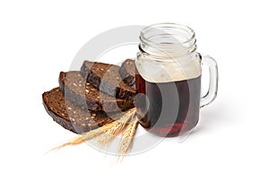 Mug of kvass with rye bread isolated on white background