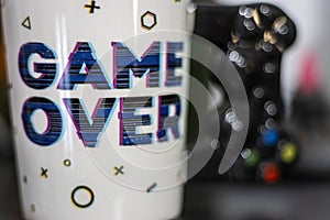 Mug with the message Game OVER. Gamer concept