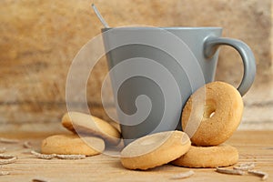 Mug of milk with biscuits and bran sticks