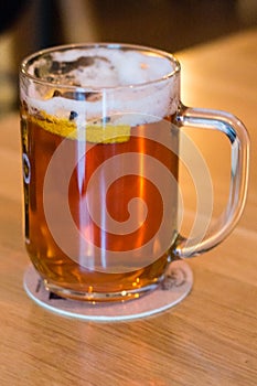 Mug of mulled beer knows in Poland as grzaniec