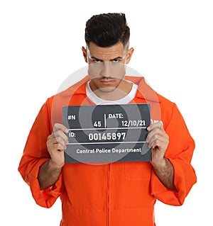 Mug shot of prisoner in orange jumpsuit with board on white background, front view