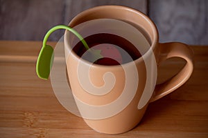 Mug of tea for breakfast. Copy space. Beige background. Still life with teacup. Tea time concept. Tasty beverage. Tea