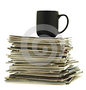 Mug on top of magazine stack