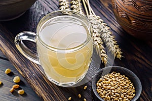 Mug of white kvass close-up