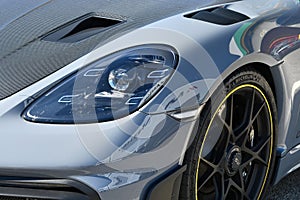 Mugello Circuit Italy 23 September 2022: Detail of the front headlight of a Porsche 718 Cayman GT4 RS on display in the Mugello Pa