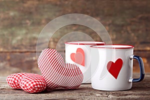 Mugs of tea with fabric hearts