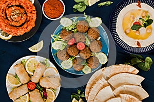 Muhammara, falafel and hummus with pita bread, vegan arabic food