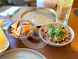 Muhammara, healthy walnut and roasted red bell pepper dip served with tortilla chips served at restaurant