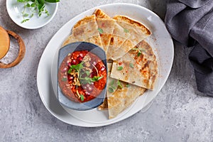 Muhammara, roasted bell pepper spread, served with roti