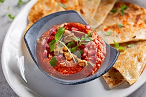 Muhammara, roasted bell pepper spread, served with roti
