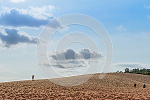 MUI NE, VIETNAM - APRIL 25 : Unidentified tourists relax and take photos on April 25,2019 at Red Sand Dunes desert in Mui Ne,